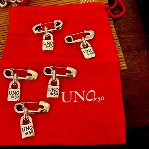 Safety pin by UNOde50. Silver plated , looks great on any outfit.